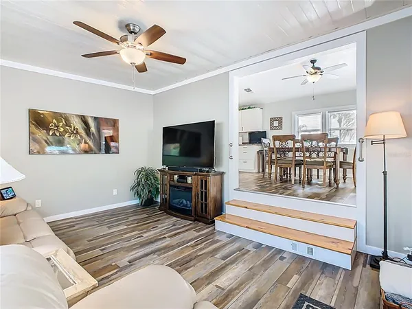a bedroom with furniture and a flat screen tv