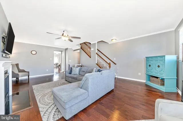 a kitchen with a table chairs refrigerator and microwave