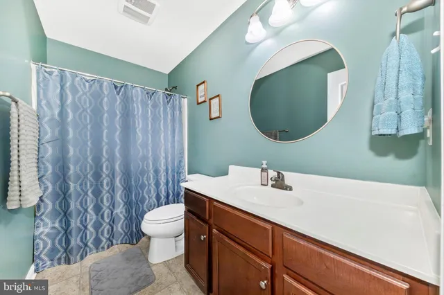 a view of a chairs and table in the balcony