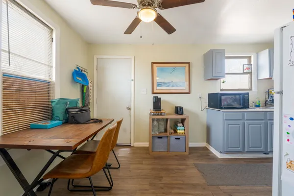 a view of a dining room with furniture and wooden floor