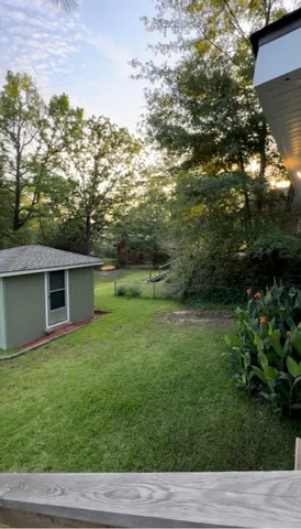 a backyard of a house with lots of green space