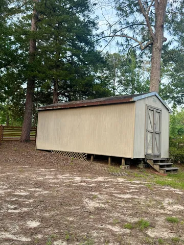 a view of a back yard of the house