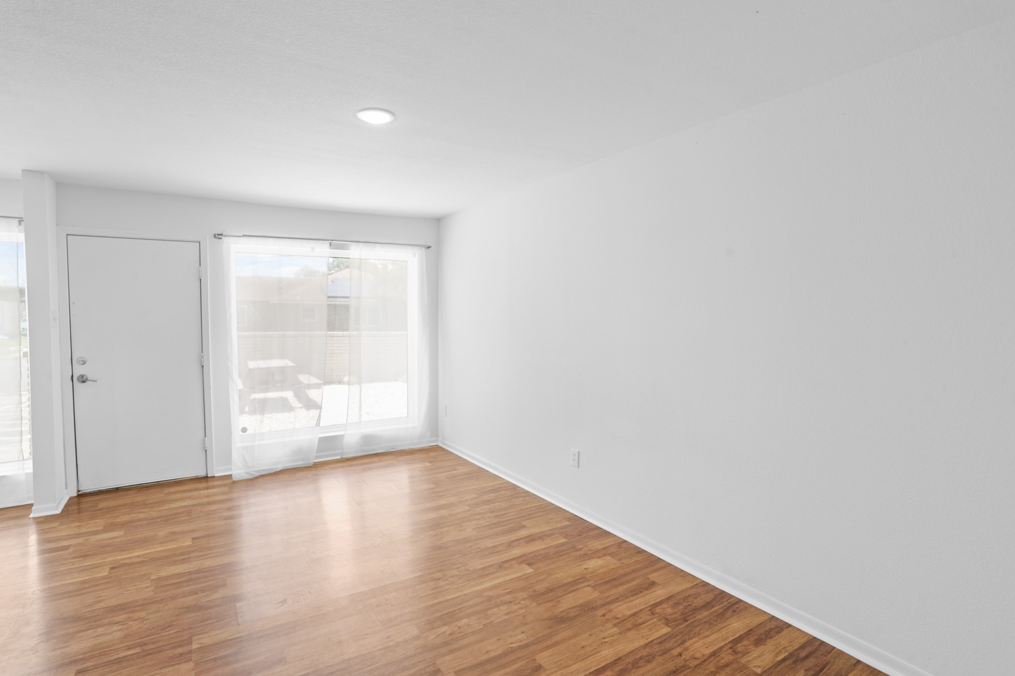 1408 Hughes Street, Unit 4 Houston, TX 77023 - Photo 19 of 27 Another view of the living space with a large picture window.