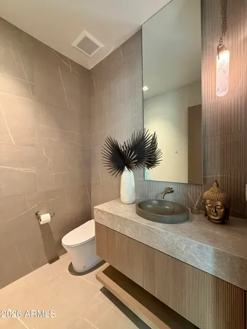 a view of a lush green hillside and houses