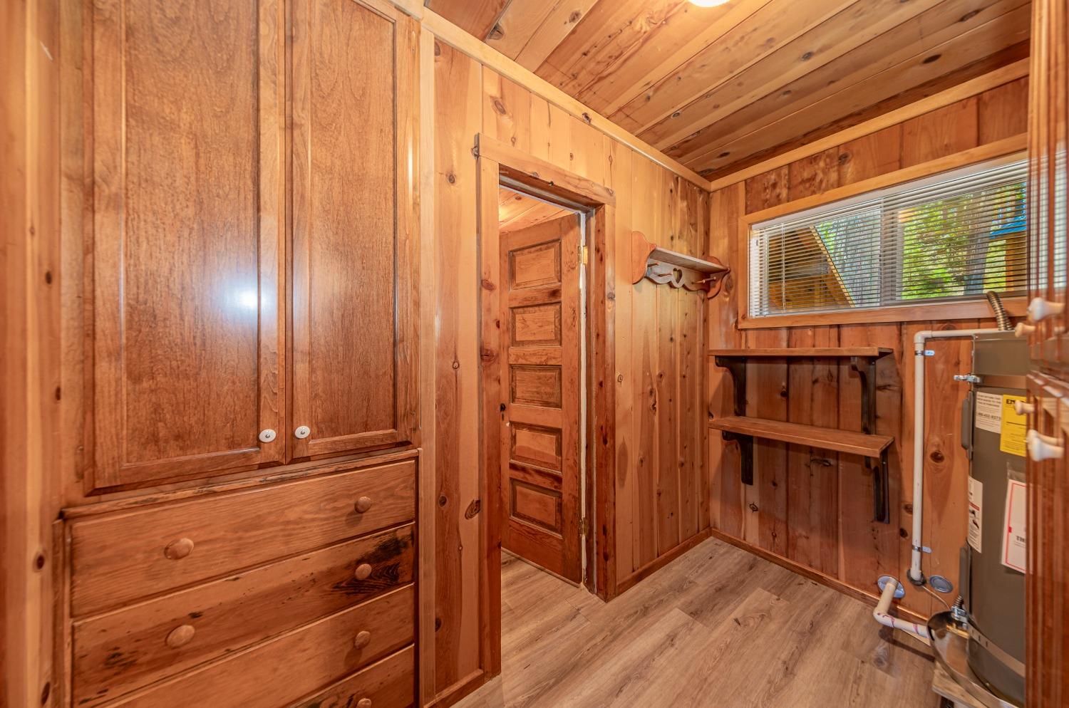 50054 Poplar Road Oakhurst, CA 93644 - Photo 15 of 34 a view of a closet area with wooden floor