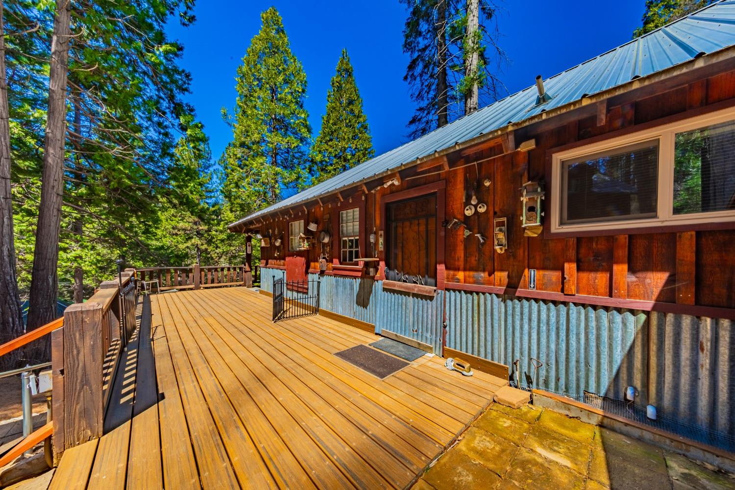 50054 Poplar Road Oakhurst, CA 93644 - Photo 21 of 34 a balcony with trees in the background