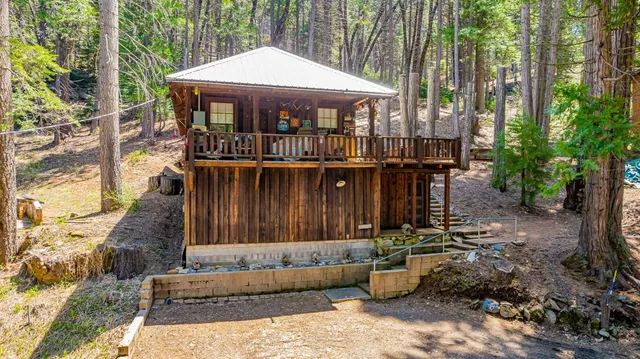 a view of a deck with furniture and garden