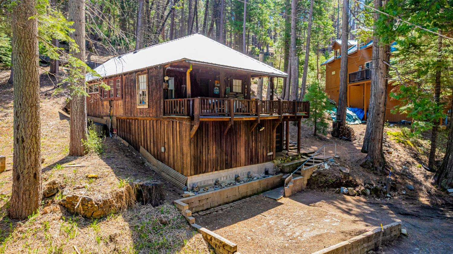 50054 Poplar Road Oakhurst, CA 93644 - Photo 30 of 34 a view of a wooden deck with a patio