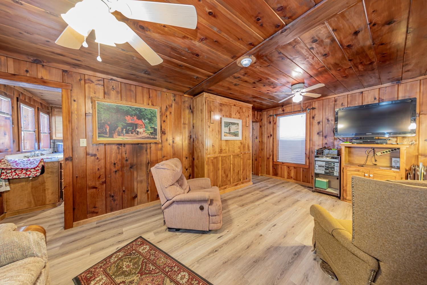 50054 Poplar Road Oakhurst, CA 93644 - Photo 4 of 34 a bedroom with furniture and a large window