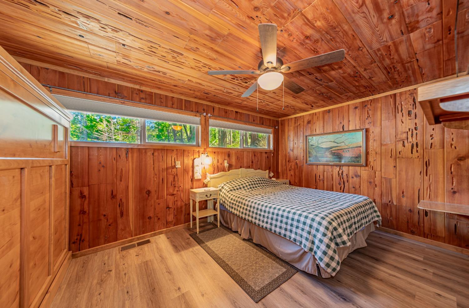 50054 Poplar Road Oakhurst, CA 93644 - Photo 5 of 34 a bedroom with a bed and a large window with the outer view