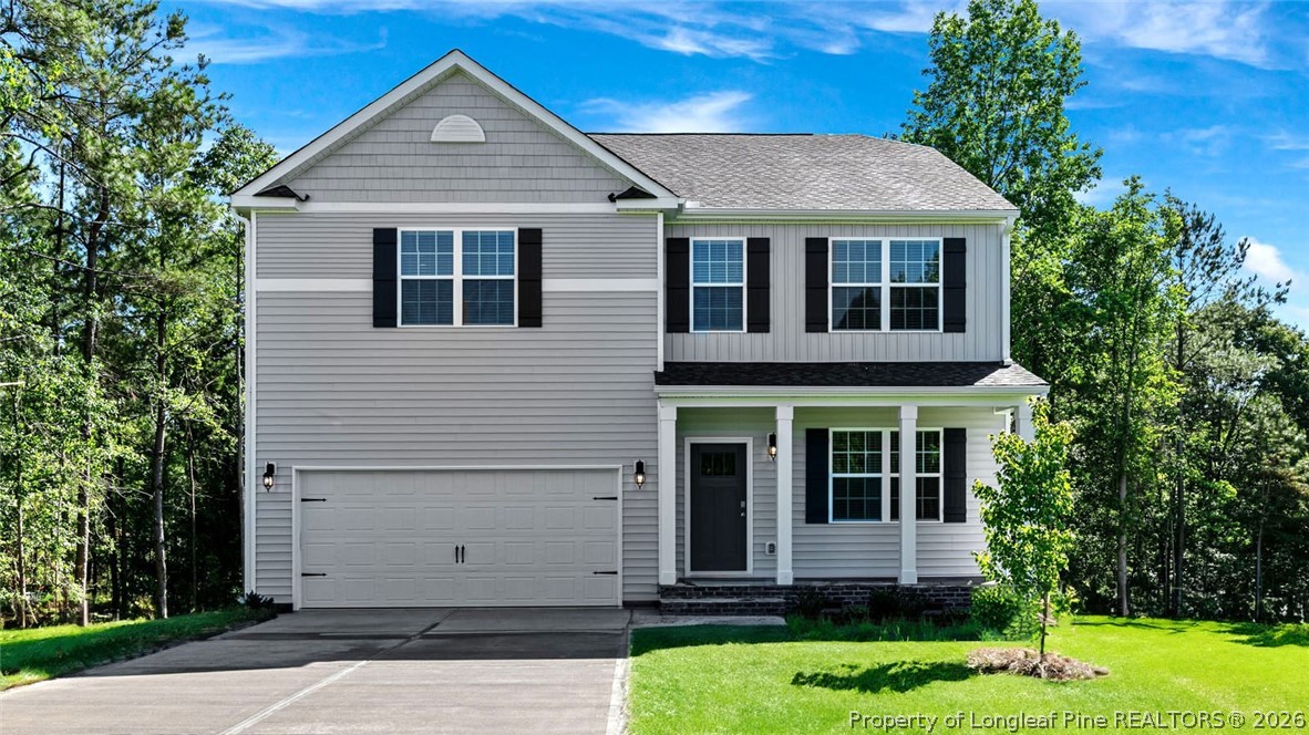 386 Hartfield Avenue Raeford, NC 28376 - Photo 1 of 32 a front view of a house with a yard
