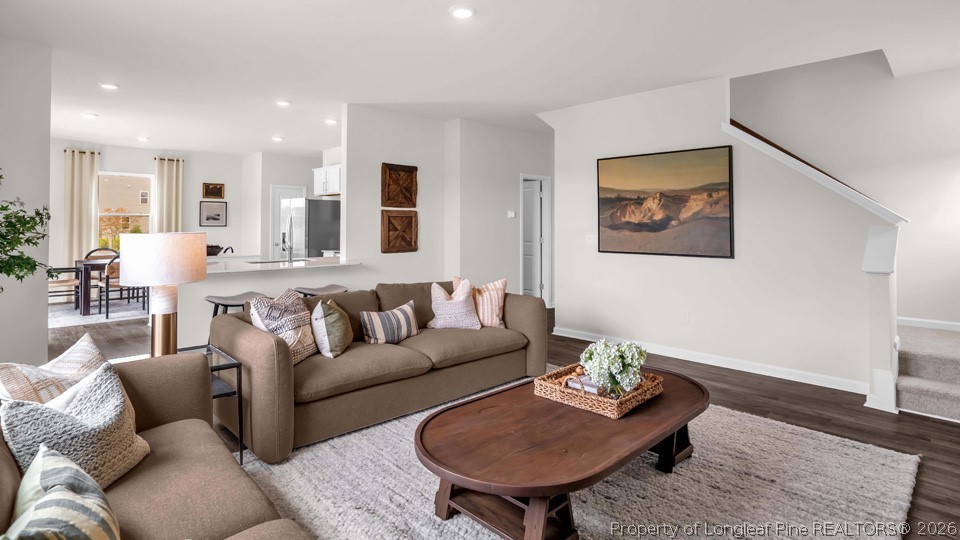 386 Hartfield Avenue Raeford, NC 28376 - Photo 14 of 32 a living room with furniture and a wooden floor