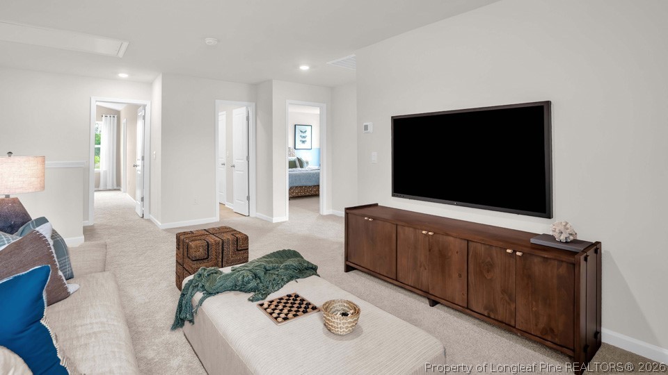 386 Hartfield Avenue Raeford, NC 28376 - Photo 16 of 32 a living room with furniture and a flat screen tv