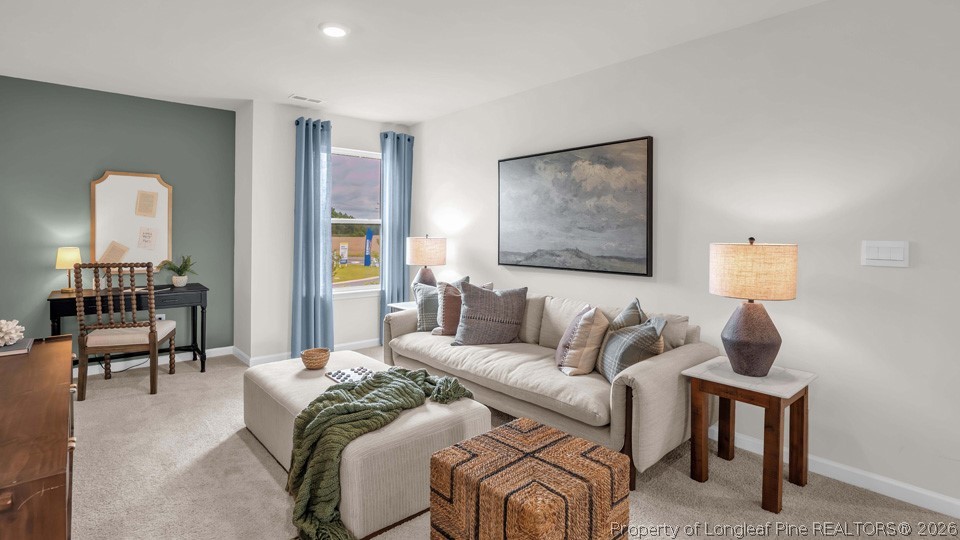 386 Hartfield Avenue Raeford, NC 28376 - Photo 21 of 32 a living room with furniture and a mirror