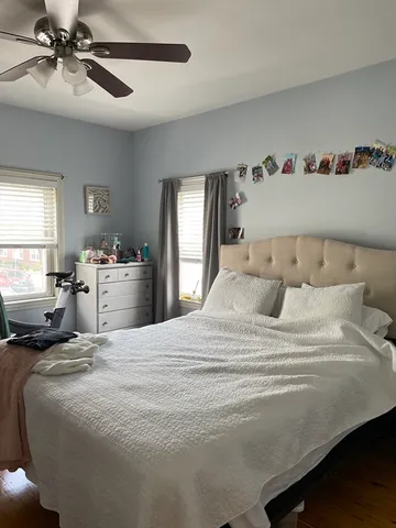 a bedroom with a bed and window