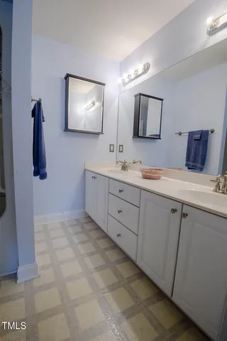 a view of bathroom with dual sinks