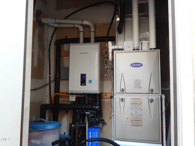 a view of storage and utility room with washer and dryer