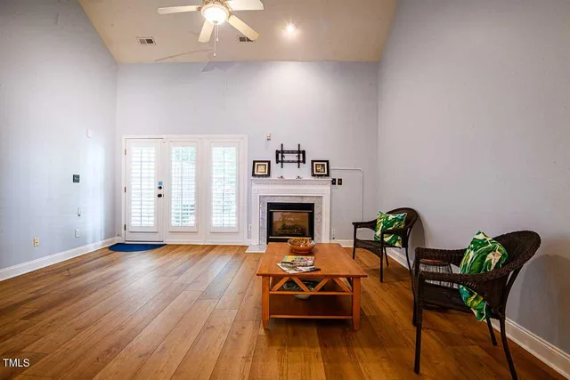 a living room with furniture and a fireplace