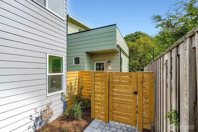 a view of front of house with wooden fence