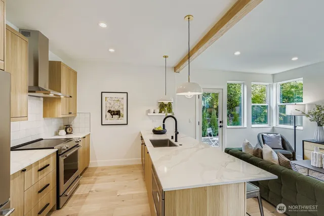 a very nice looking dining room with a large window