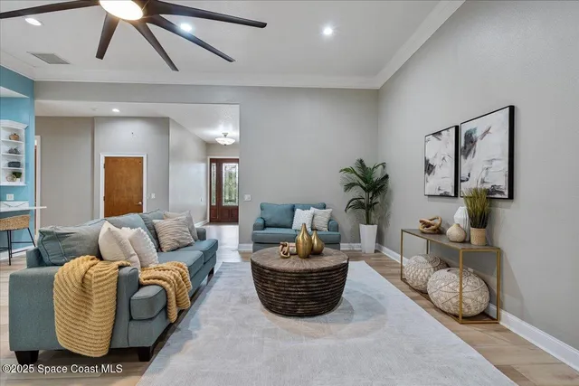 a kitchen with kitchen island granite countertop a sink and refrigerator