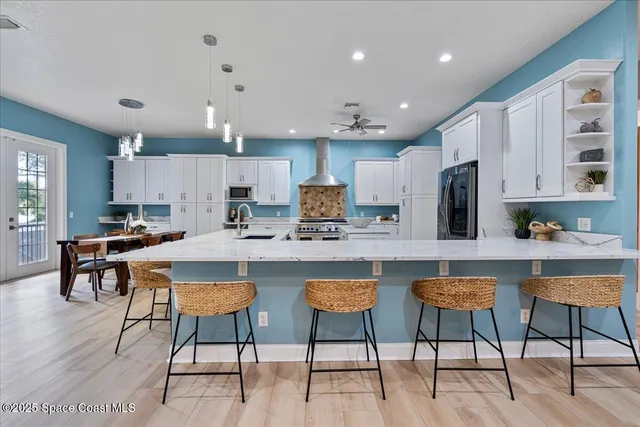 a stove top oven sitting inside of a kitchen