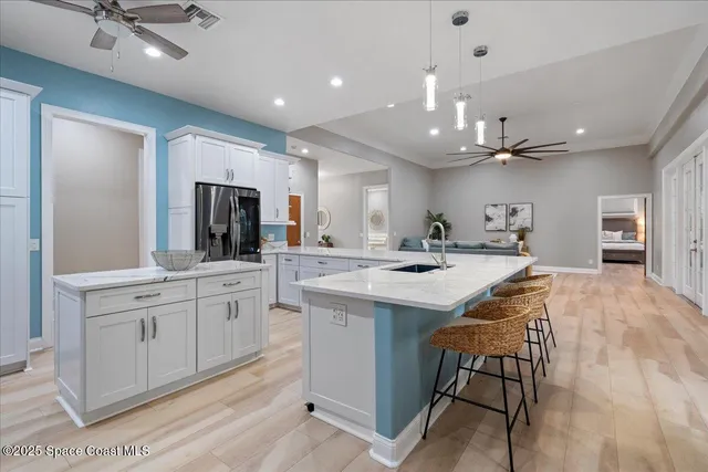 a bathroom with a granite countertop toilet sink and mirror