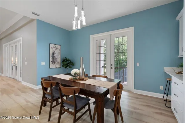 a kitchen with stainless steel appliances white cabinets and a sink