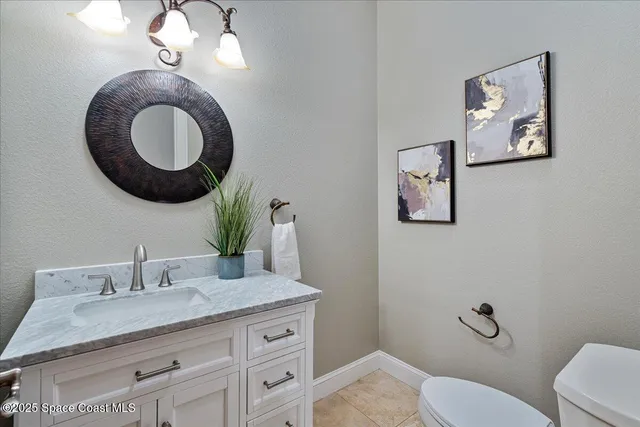 a bathroom with a sink a toilet a shower and a mirror