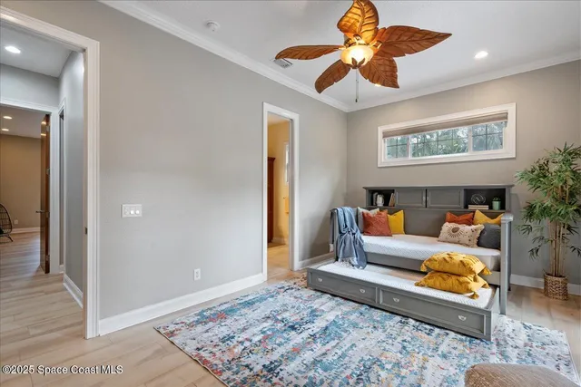 a bedroom with a large bed and a large window