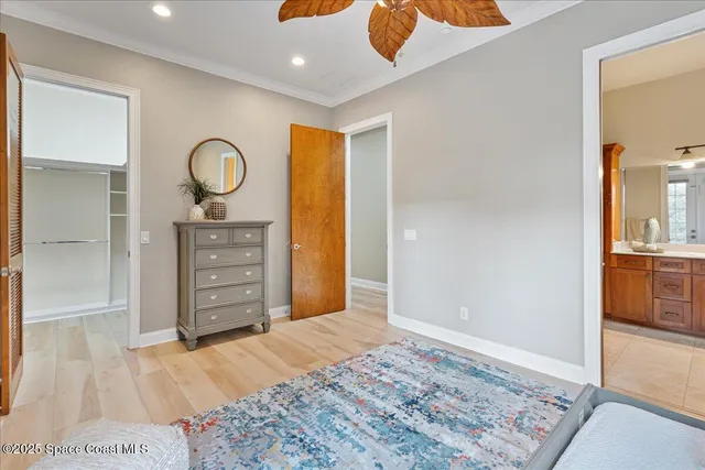a bedroom with furniture and flat screen tv