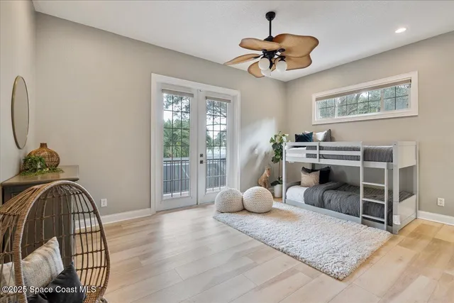 a spacious bathroom with a tub sink and mirror