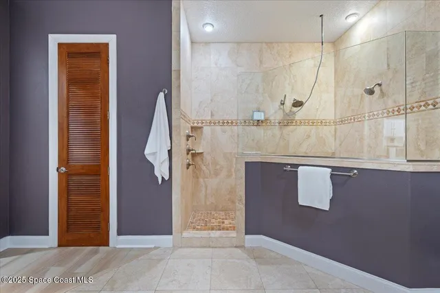 an aerial view of a house with a yard and garden