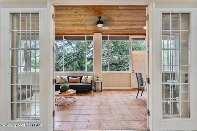 an aerial view of a house with a yard and lake view