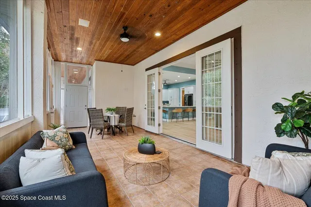 an aerial view of a house with a yard and lake view