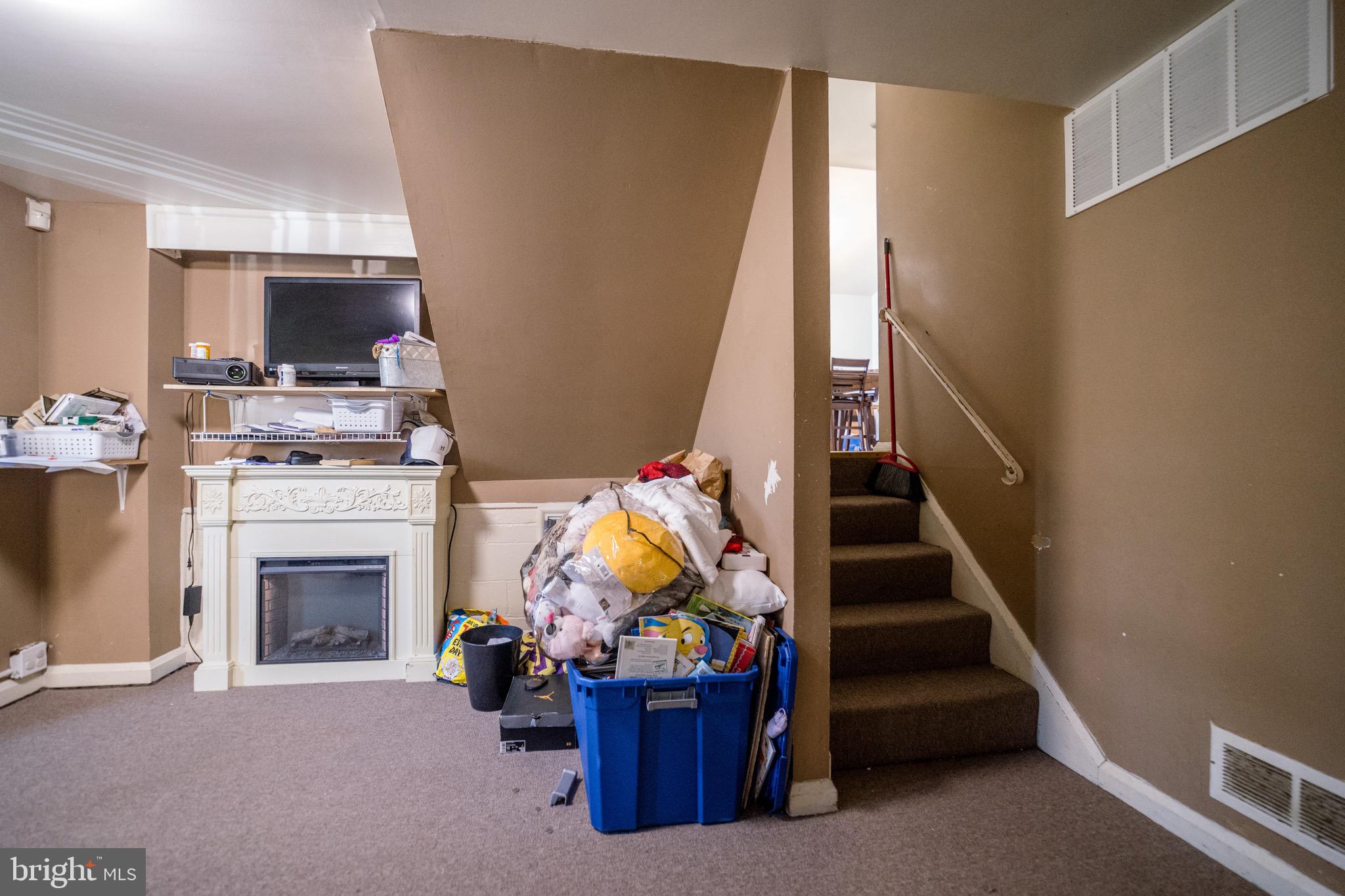 4125 Ronis Road Pikesville, MD 21208 - Photo 21 of 40 a living room with furniture and a fireplace