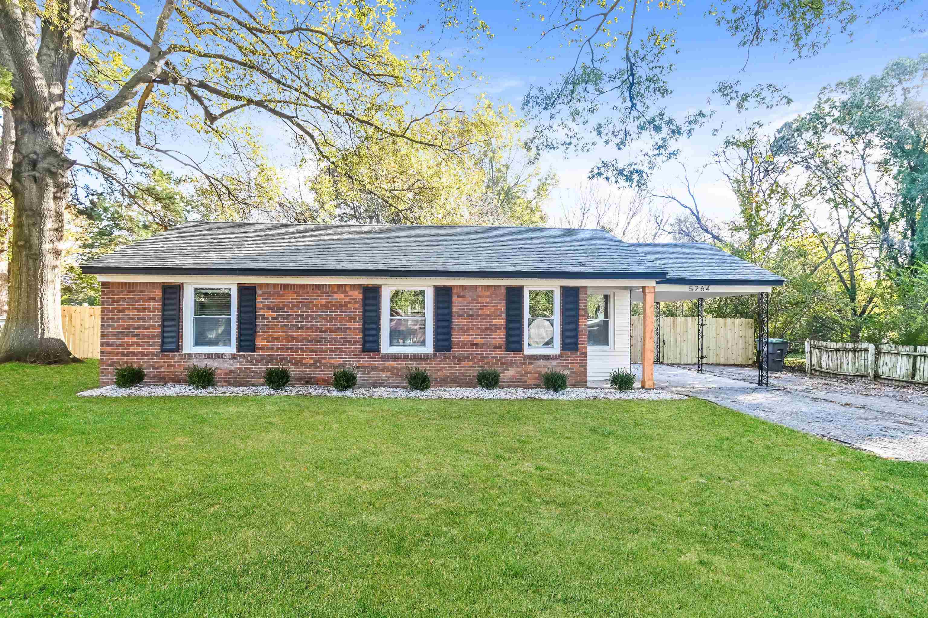 5264 Lochinvar Road Memphis, TN 38116 - Photo 1 of 13 front view of a house with a yard