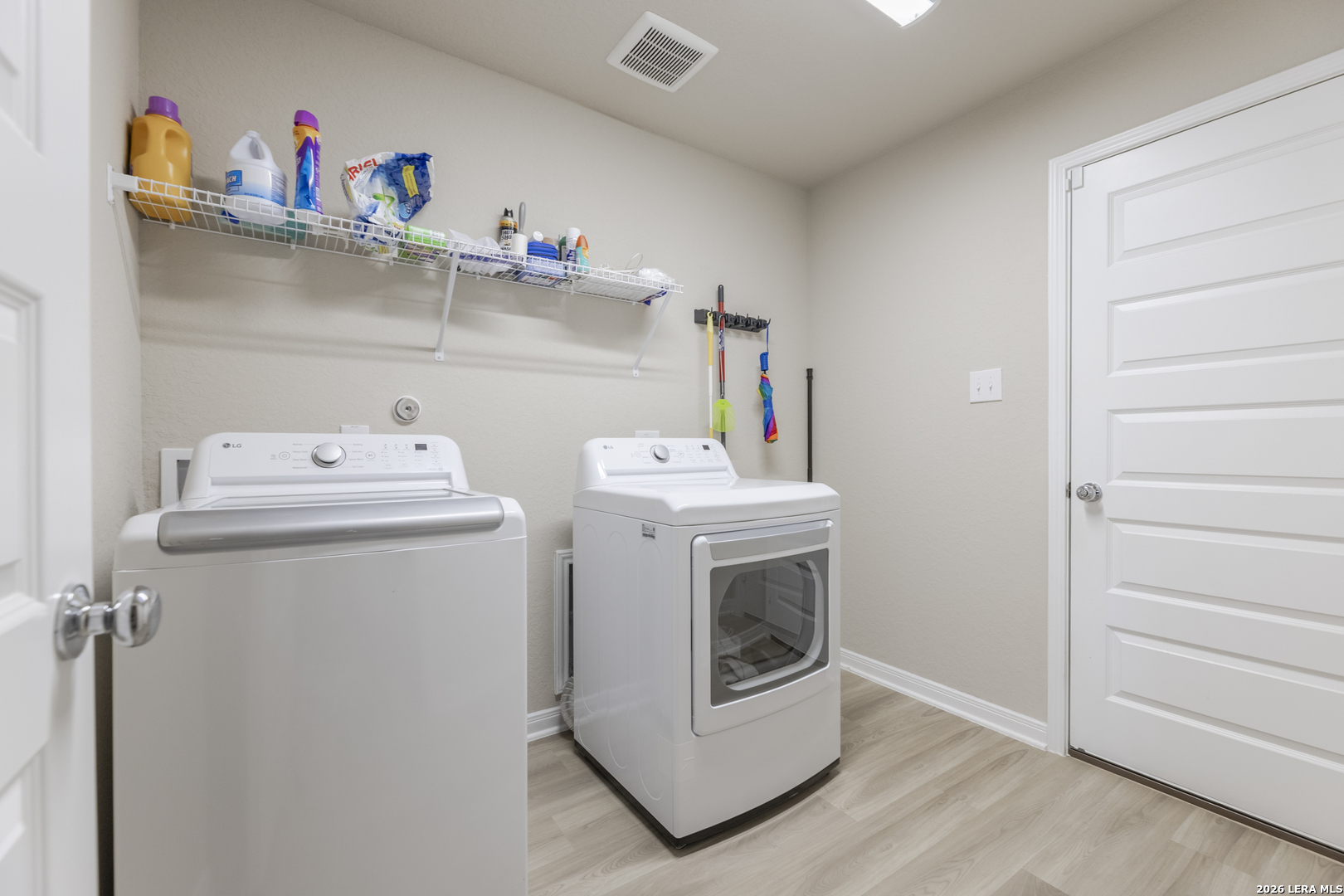 3035 Selhurst Street Converse, TX 78109 - Photo 15 of 18 a utility room with dryer and washer