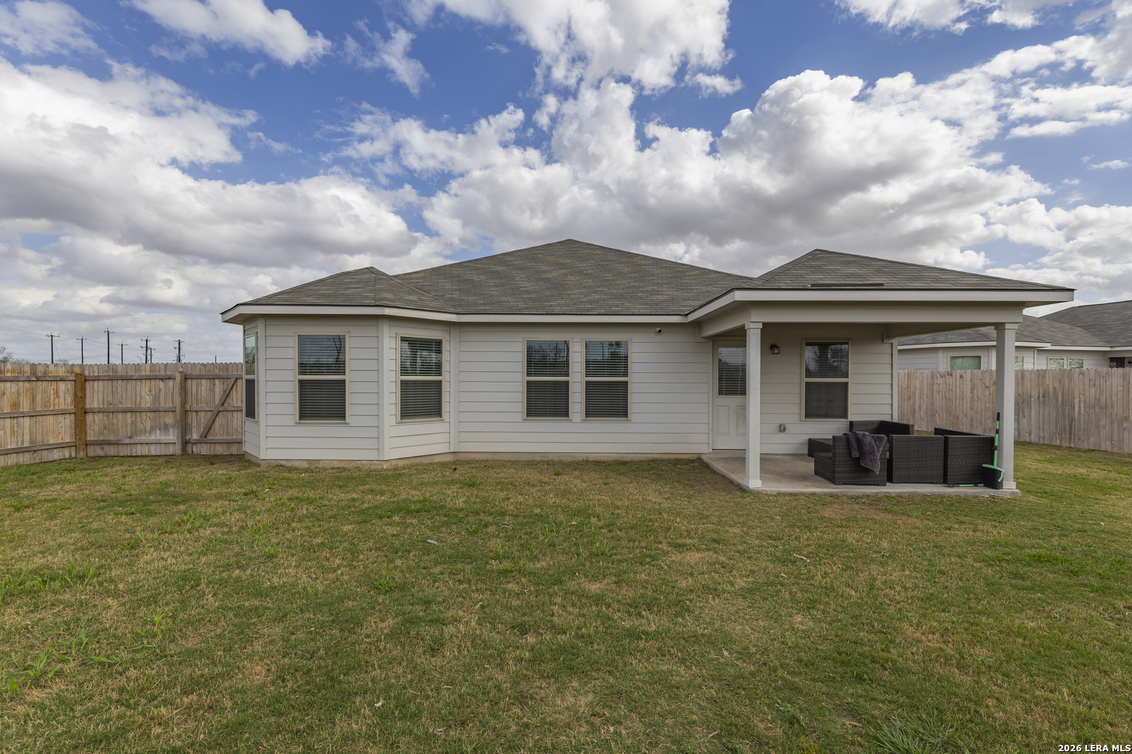 3035 Selhurst Street Converse, TX 78109 - Photo 16 of 18 a view of a house with a yard