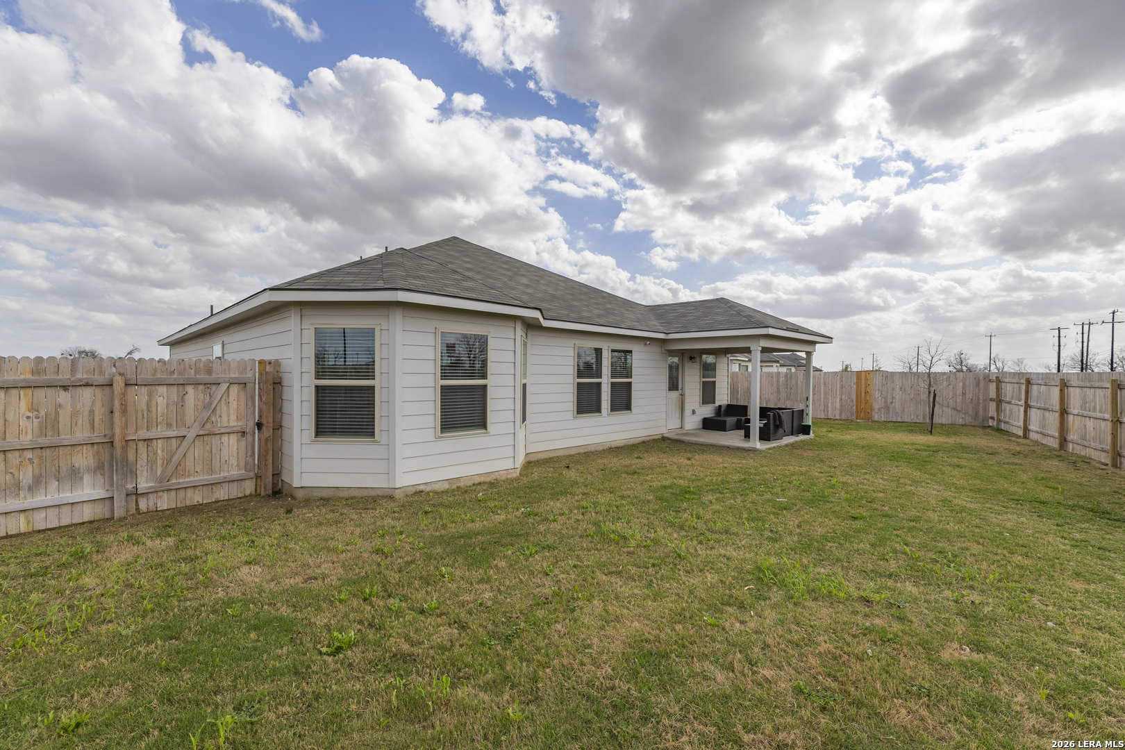 3035 Selhurst Street Converse, TX 78109 - Photo 18 of 18 a view of a yard in front of a house with large trees