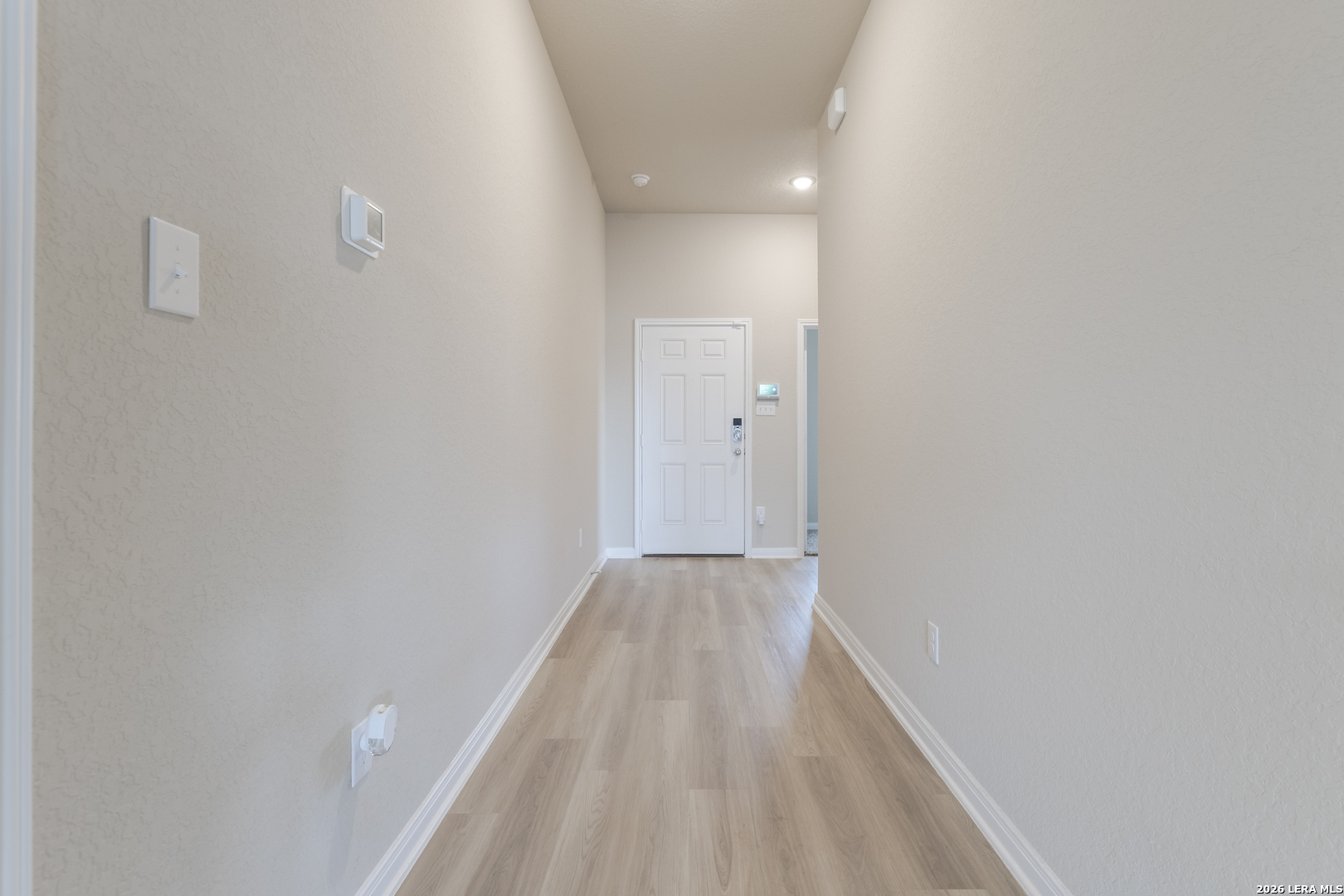 3035 Selhurst Street Converse, TX 78109 - Photo 7 of 18 a view of hallway with wooden floor