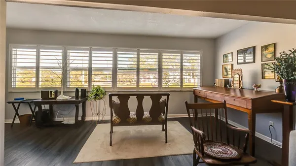 a view of a dining room with furniture window and wooden floor