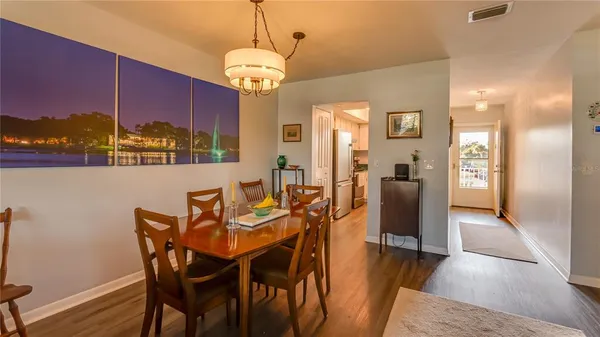 a view of a dining room with furniture window and wooden floor