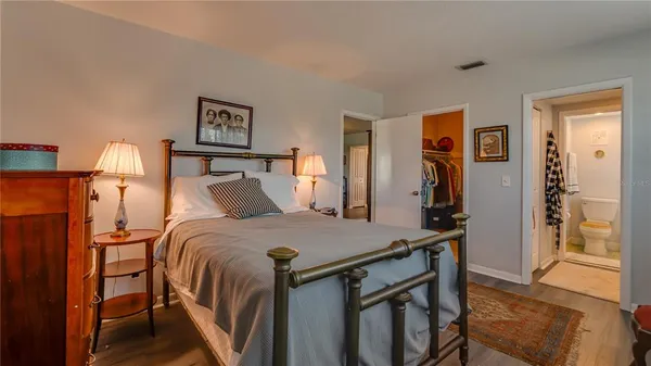 a bedroom with a bed and a table in it