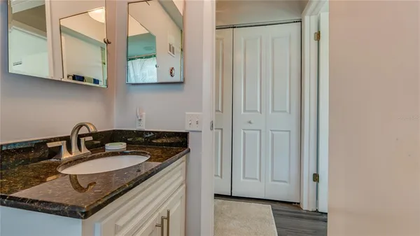 a bathroom with a sink and a mirror