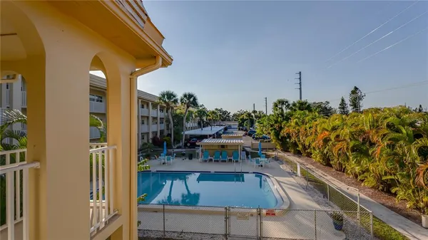 a view of balcony with furniture