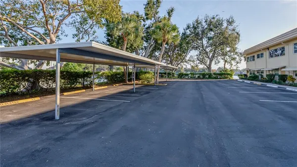 a view of a house with backyard and porch