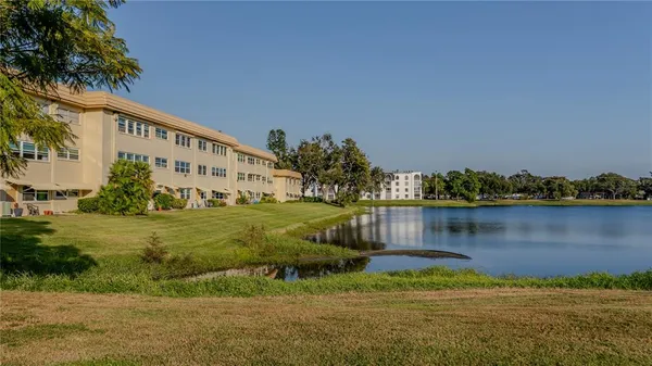 a view of a lake with a building in the background