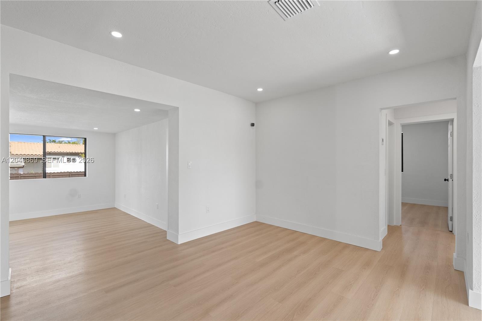 31 West 64th Street Hialeah, FL 33012 - Photo 15 of 49 a view of an empty room with wooden floor