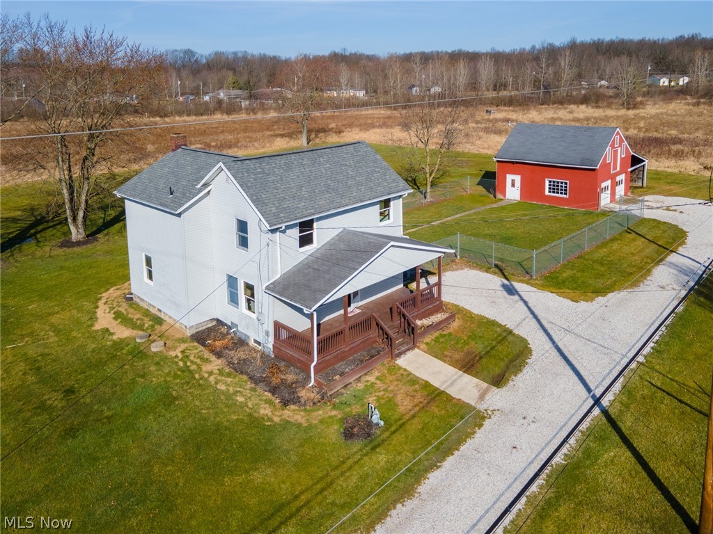 16333 Courtney Road Alliance, OH 44601 - Photo 2 of 31 Front of home with front porch, fenced yard and garage